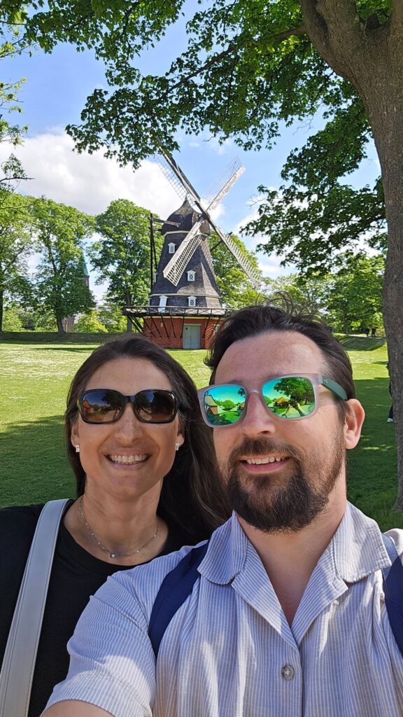 couple on cipenhagen with mill behind